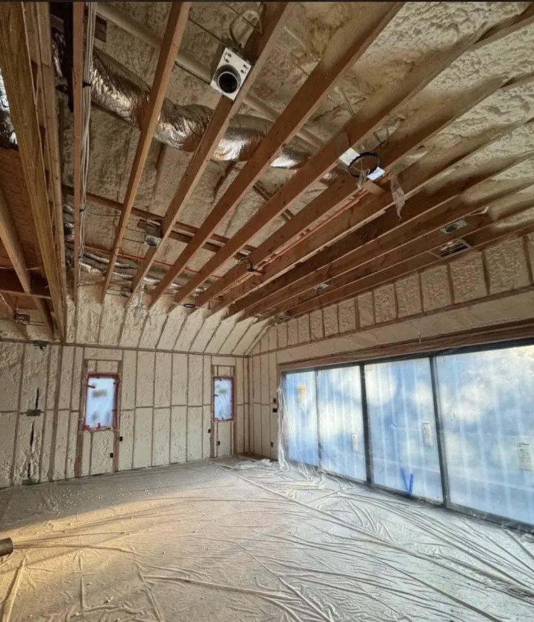 Interior walls and ceiling insulated with spray foam during new construction in Orlando